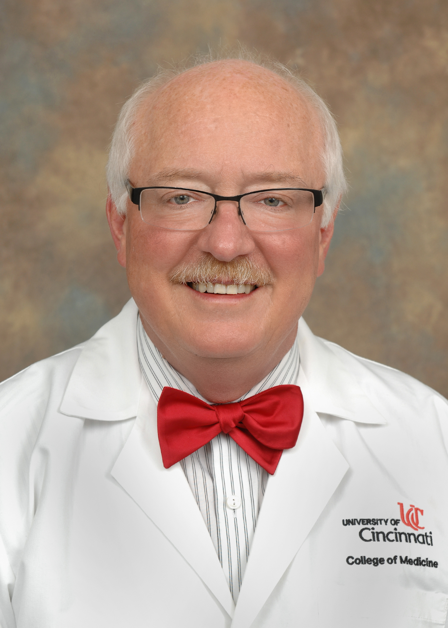 Herman James  white coat