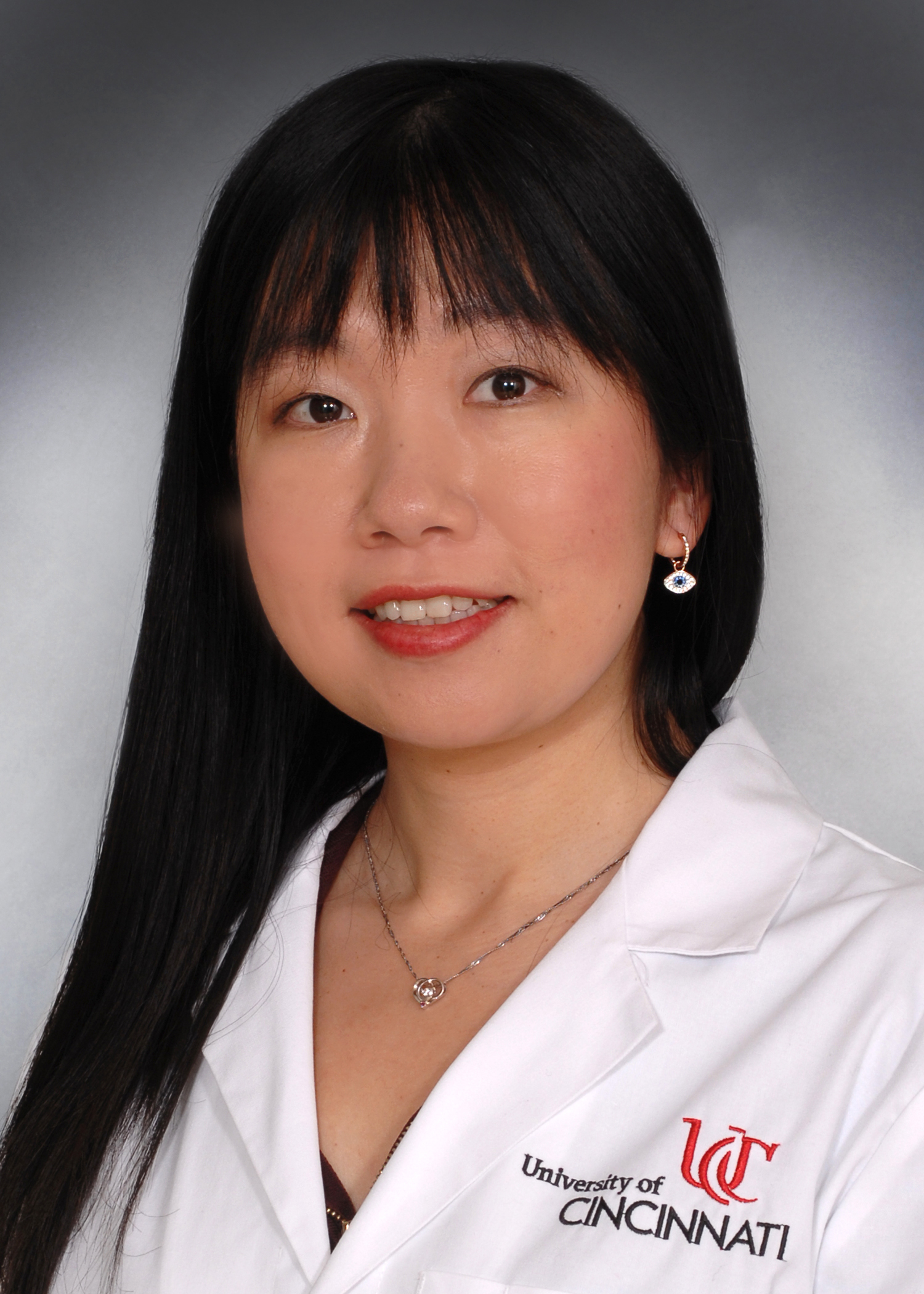 Gao Chen with UC lab coat